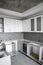Custom kitchen cabinets installation with a furniture facades mdf. Gray modular kitchen from chipboard material on a