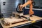 custom robotic arm with saw, drill, and other tools for intricate industrial applications