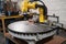 custom robotic end-effector with saw blade, used for metal plates