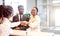 Customer buying a vehicle at car dealership. woman and man handshaking