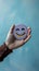 Customer delight Womans hand holds happy face icon, positive experience