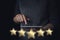 Customer experience. Service rating and review. Assessment survey. Five star shapes against the background of a woman giving an