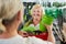 A customer in the garden center gets help with shopping