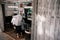 Customer gets a haircut in old fashioned barber shop