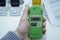 Customer hand holding personal dosimeter-radiometers for measuring levels of radiation