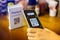 Customer hand using smart phone to scan QR code Tag to accepted generate digital pay without money