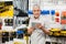 Customer Holding Digital Tablet In Hardware Store