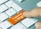Customer is king - Inscription on Orange Keyboard Key