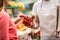 Customer picking strawberries at street market