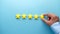 Customer review concept. Rating golden stars on blue background