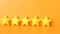 Customer review concept.Rating golden stars on orange background