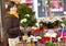 Customer selecting flowers at market