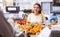 Customer selects ripe tangerines on counter