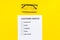 Customer service form with mark Exellent close up on yellow background top view copy space