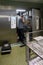 Customer service representative repairs a steam sterilizer in a hospital