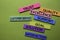 Customer Service, Trust, Quality, Excellence, Support, Goal, Solution, Satisfaction text on sticky notes isolated on green desk.