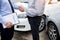 Customer shake hand with auto insurance agents after agreeing to