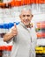 Customer Showing Thumbs Up Sign In Hardware Shop