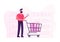 Customer Stand in Grocery or Supermarket with Goods in Shopping Trolley Holding Smartphone in Hand. Man Visiting Store