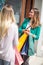 Customer women in shopping street looking at window