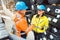 Customer and worker in steel delivery warehouse shaking hands