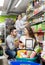 Customers at beverages section of supermarket