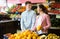 Customers buying oranges