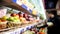 Customers choose products in grocery shelf with fruit an vegetables in supermarket