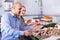 Customers choosing seafood in fish store and smiling