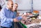 Customers choosing seafood in fish store and smiling