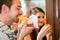 Customers eating Hotdog in fast food snack bar