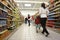 Customers shopping at supermarket