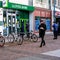 Customers Using A Lloyd Bank ATM To Withdraw Money