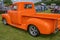 Customised Chevrolet pickup truck painted bright orange