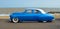 Customized blue vintage car on seafront promenade