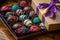 customized box of assorted truffles, with colorful wrap and ribbon for holiday gift