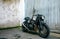 Customized motorcycle in front of garage door