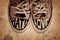 Customized used sneakers with words hate and love on grunge texture background