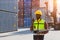 Customs shipping staff worker working at cargo port container ship yard with radio control