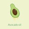 cut avocado with a drop of oil on a beige background
