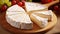 Cut brie cheese a soft French cheese on a wooden board