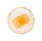 Cut comb honey on plate isolated