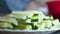 Cut Cucumber Sticks On A White Plate. Can Be Used To Make Salads Or Hosomaki, Cucumber Sushi Rolls, Or Kappa Maki. Blurred Kitchen