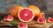 Cut fresh grapefruit with a knife on a cutting Board rotates slowly.