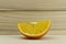 Cut fresh juicy natural sour orange half on wooden background