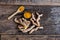 Cut fresh turmeric stem on wood background, herb concept, traditional asian spice