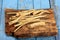 Cut Horseradish roots Armoracia rusticana taproot on rustic wooden board