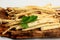 Cut Horseradish roots Armoracia rusticana taproot on rustic wooden board