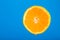 Cut orange. Orange juice drips. Half the fruit. Fresh citruses. Oranges on a blue background. Juicy fruit. Naral vitamins.