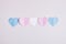 cut out colored paper hearts on gray background, transexual colors, lgbt pride concept